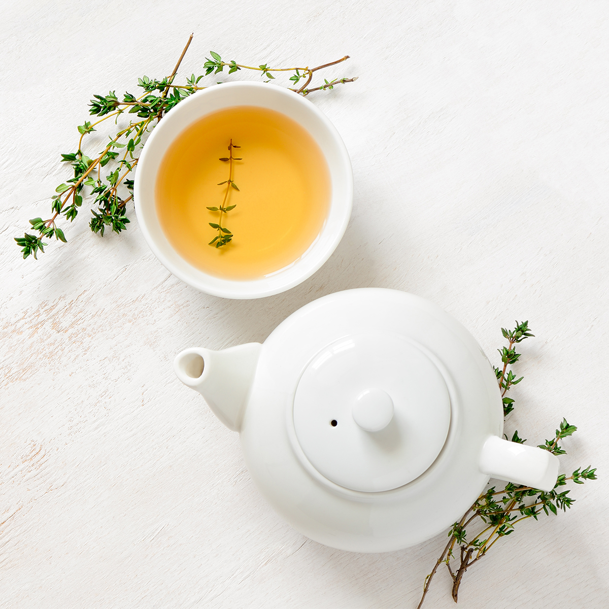 A pot and a cup of tea on a table