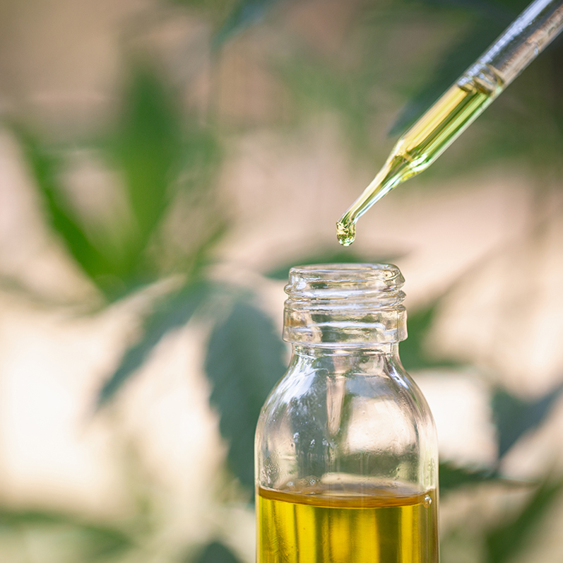 Image of an eyedropper extracting liquid from a bottle