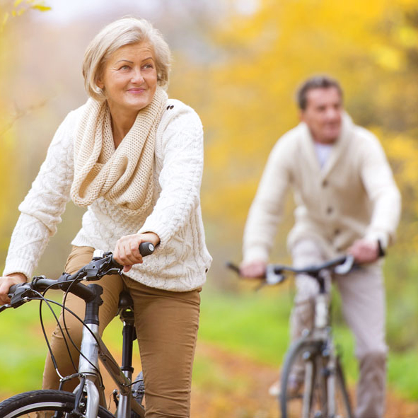 Older couple on bicycles