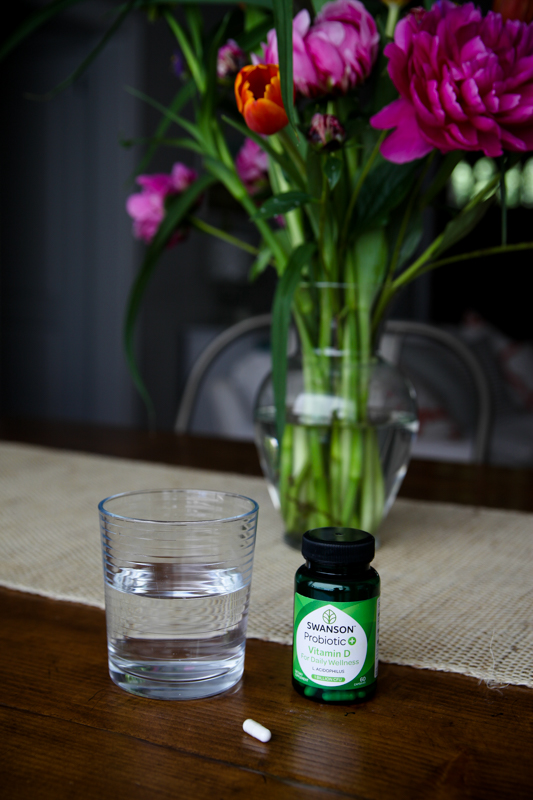 Probiotics in front of a vase