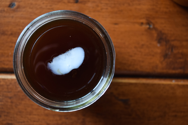 frozen coconut oil cube in coffee