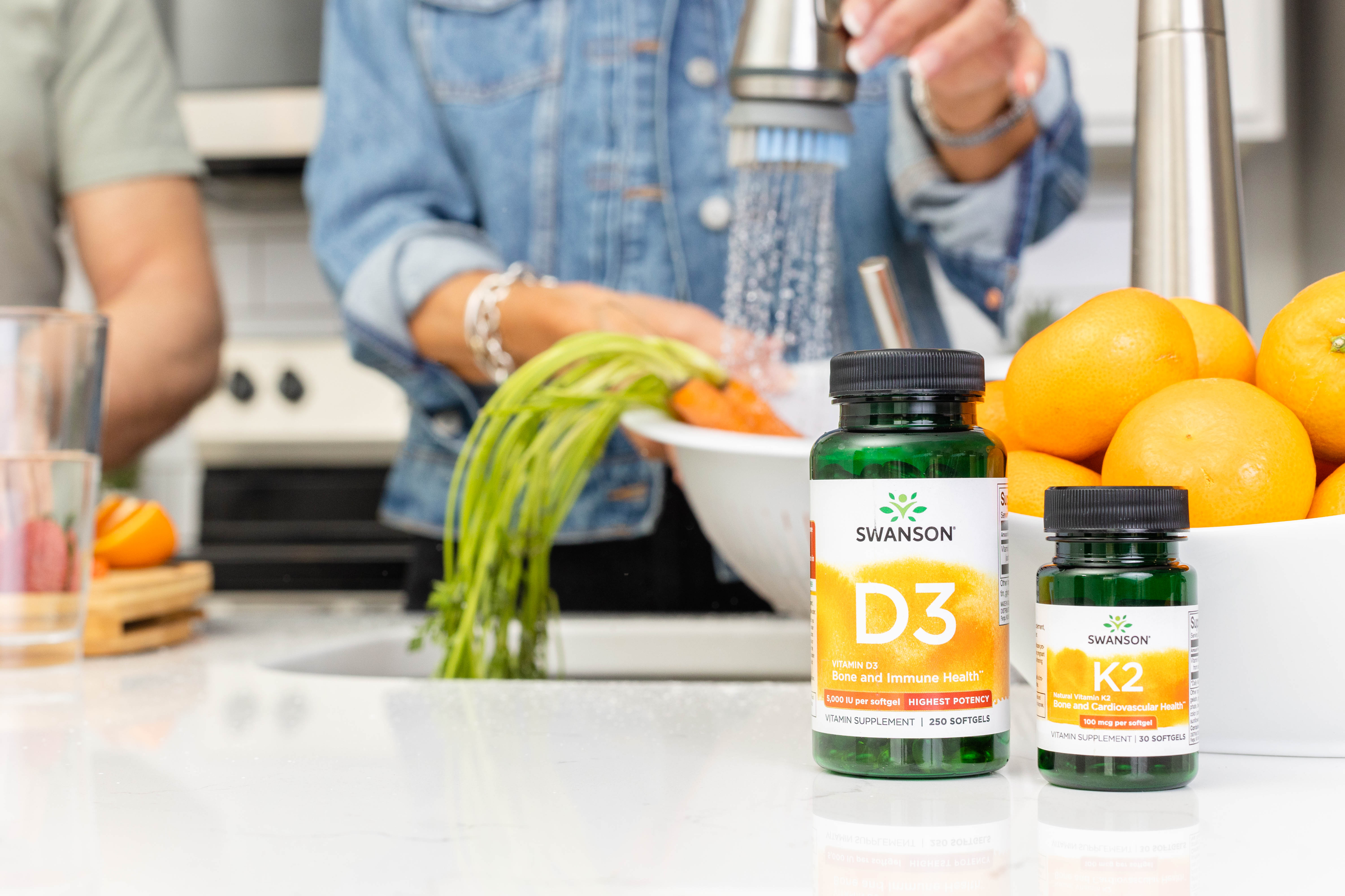 Bottles of Vitamins D3 and K2 on a kitchen counter