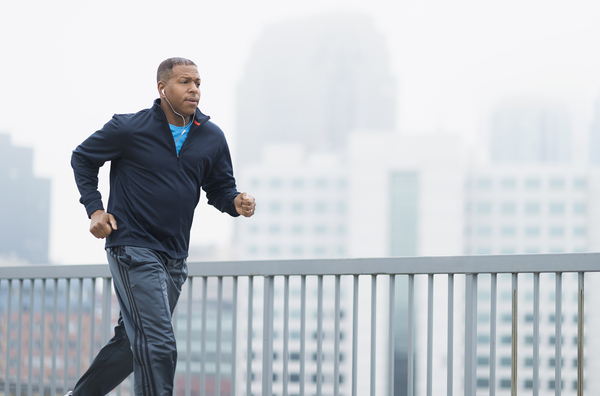 a man jogging on a bridge